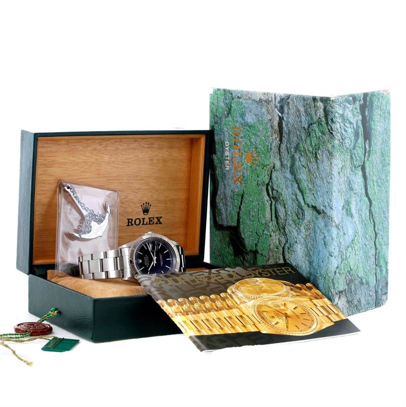 The image shows a Rolex Turn-o-Graph 16264 Men's Stainless Steel Black Dial 16264 Men's Stainless Steel Black Dial watch, its box, an instruction booklet, hangtags, and a bracelet accessory.