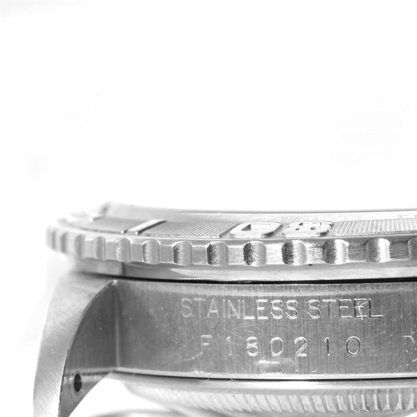 The image shows a close-up side view of the bezel and part of the case of a Rolex Turn-o-Graph 16264 Men's Stainless Steel White Dial 16264 Men's Stainless Steel White Dial watch, showcasing its stainless steel material.