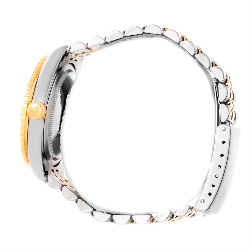 This is a side view of the Rolex Turn-o-Graph 16263 Men's Steel and Gold (two tone) White Dial 16263 Men's Steel and Gold (two tone) White Dial model, showing its case, crown, and bracelet.