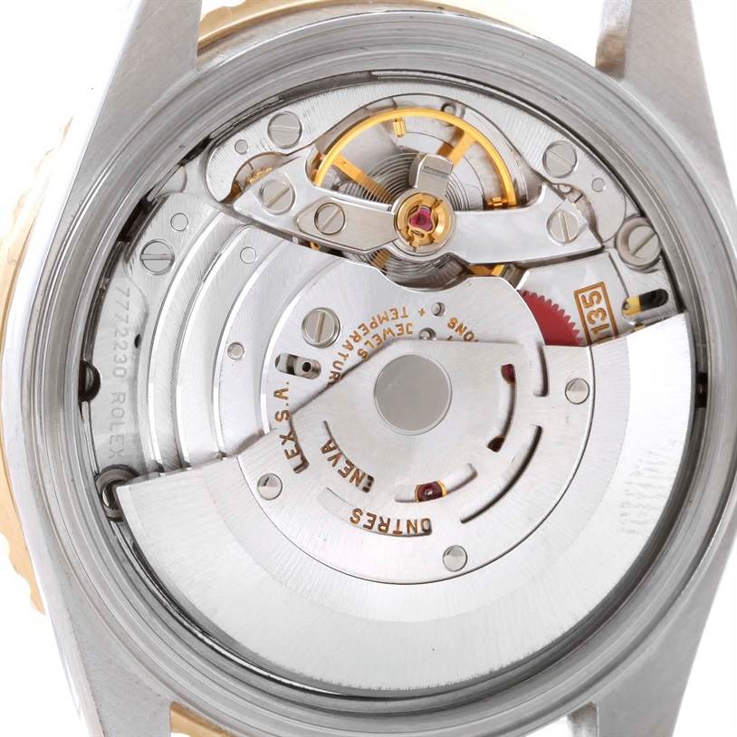 The image shows the back view of the Rolex Turn-o-Graph 16263 Men's Steel and Gold (two tone) White Dial 16263 Men's Steel and Gold (two tone) White Dial watch, highlighting its intricate mechanical movement and parts.