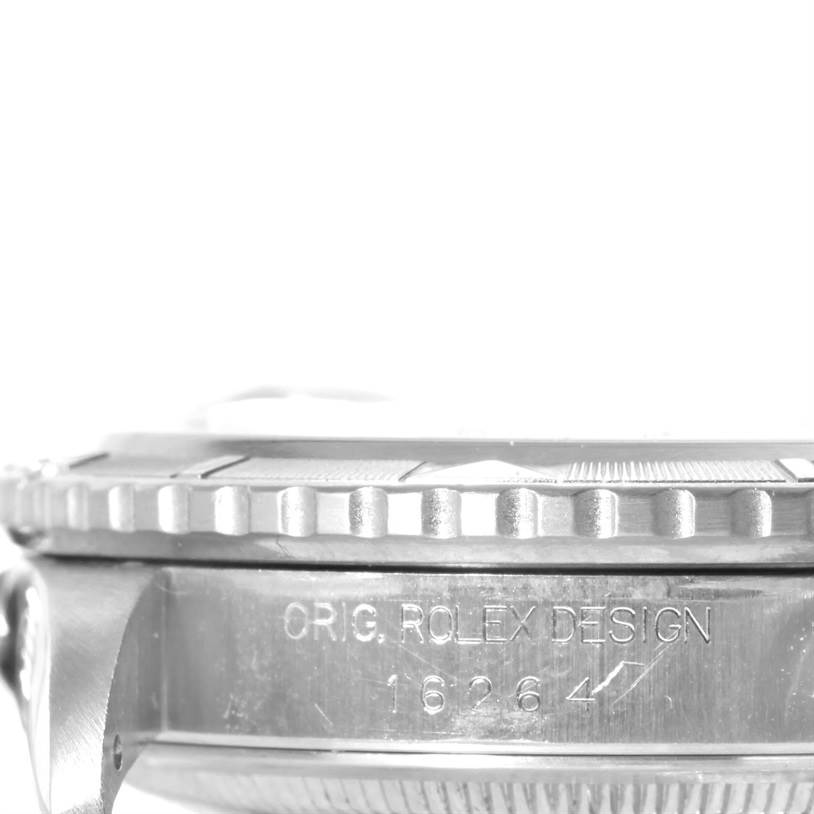 This image shows a side view of the Rolex Turn-o-Graph 16264 Men's Stainless Steel Black Dial 16264 Men's Stainless Steel Black Dial watch, focusing on the bezel and engraved serial number.