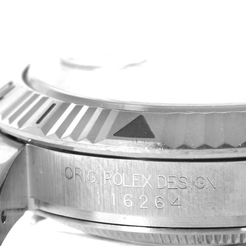 The image shows a close-up of the side view of the Rolex Turn-o-Graph 116264 Men
s Stainless Steel White Dial 116264 Men
s Stainless Steel White Dial watch case, focusing on the bezel and engraving.