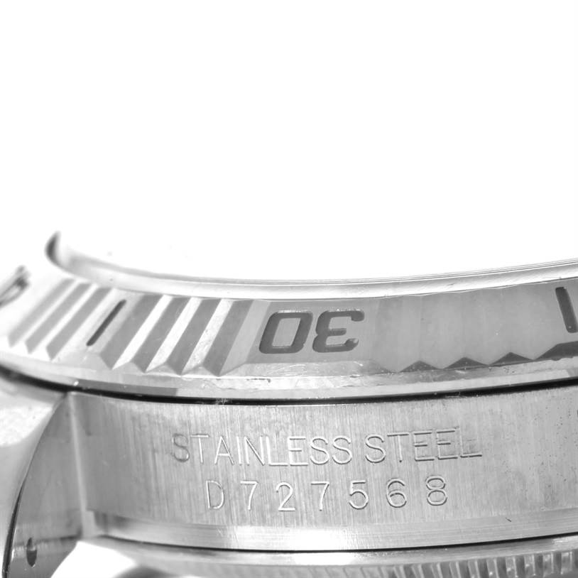 The image shows a close-up of the bezel and side engravings of a Rolex Turn-o-Graph 116264 Men
s Stainless Steel White Dial 116264 Men
s Stainless Steel White Dial watch, highlighting the "30" marker and stainless steel label.