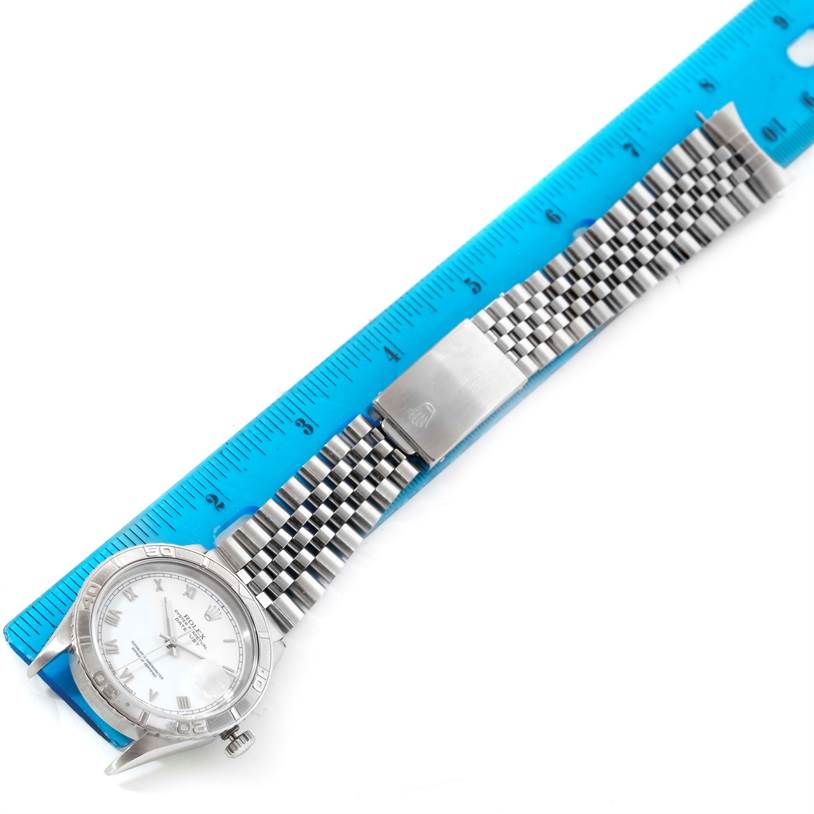 The image shows a Rolex Turn-o-Graph 16264 Men's Stainless Steel White Dial 16264 Men's Stainless Steel White Dial watch laid flat next to a blue ruler, displaying the bezel, dial, and metal bracelet.