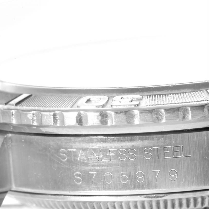 The image shows a close-up side view of the Rolex Turn-o-Graph 16264 Men's Stainless Steel White Dial 16264 Men's Stainless Steel White Dial watch, highlighting its bezel and part of the stainless steel case with serial numbers.