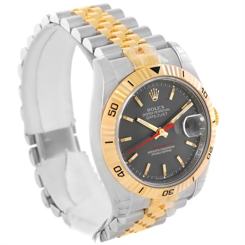 The Rolex Turn-o-Graph 116263GYSJ Men's Steel and Gold (two tone) Grey Dial 116263GYSJ Men's Steel and Gold (two tone) Grey Dial watch is shown from an angled side view, featuring its dial, bezel, and part of the bracelet.