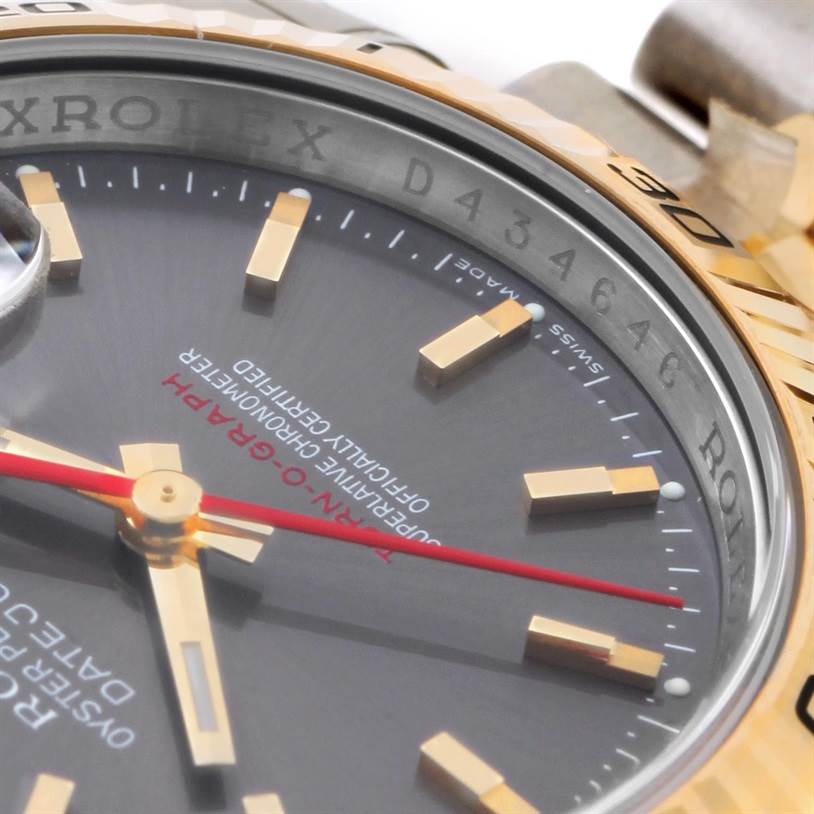 This image shows a close-up of the dial and bezel of the Rolex Turn-o-Graph 116263GYSJ Men's Steel and Gold (two tone) Grey Dial 116263GYSJ Men's Steel and Gold (two tone) Grey Dial watch, highlighting the hands and markings.