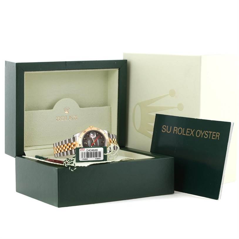 The Rolex Turn-o-Graph 116263GYSJ Men's Steel and Gold (two tone) Grey Dial 116263GYSJ Men's Steel and Gold (two tone) Grey Dial watch is shown in its box at a front angle with accompanying booklet and tags visible.
