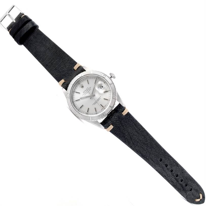 The image shows a Rolex Turn-o-Graph 16264 Men's Stainless Steel Silver Dial 16264 Men's Stainless Steel Silver Dial watch from a top-down angle, featuring the face, bezel, crown, and leather strap.