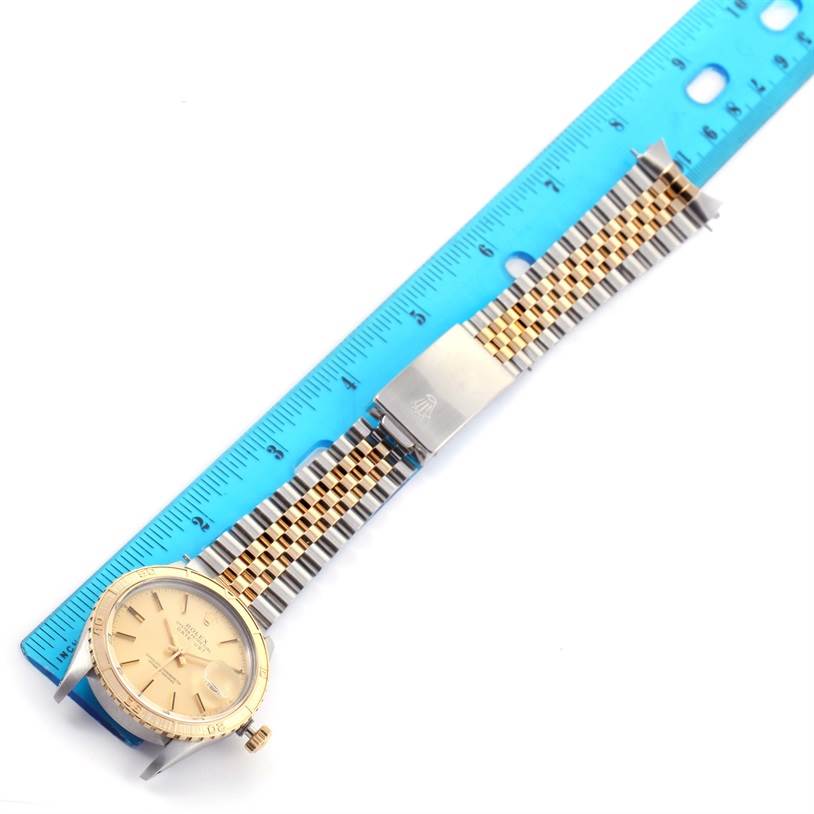 The image shows a Rolex Turn-o-Graph 16263 Men's Steel and Gold (two tone) Champagne Dial 16263 Men's Steel and Gold (two tone) Champagne Dial watch, laid flat with both the watch face and the bracelet visible, alongside a blue ruler for scale.