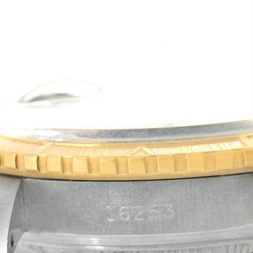 This image shows a close-up of the Rolex Turn-o-Graph 16263 Men's Steel and Gold (two tone) Champagne Dial 16263 Men's Steel and Gold (two tone) Champagne Dial model's case side, bezel, and serial number.