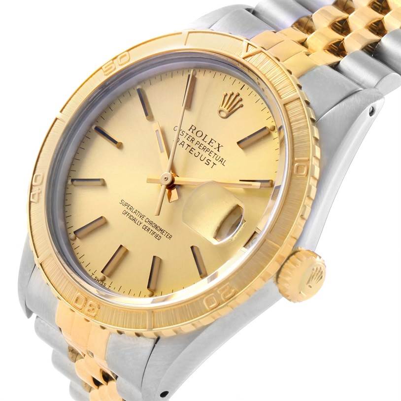 This image showcases the face, bezel, crown, and part of the bracelet of the Rolex Turn-o-Graph 16263 Men's Steel and Gold (two tone) Champagne Dial 16263 Men's Steel and Gold (two tone) Champagne Dial watch at an angled view.