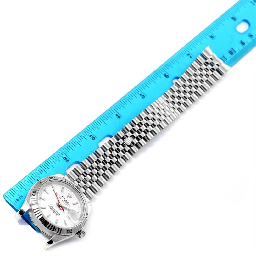 The image shows a Rolex Turn-o-Graph 116264 Men's Stainless Steel White Dial 116264 Men's Stainless Steel White Dial watch laid flat with its dial, bezel, and bracelet, alongside a blue ruler for measurement.