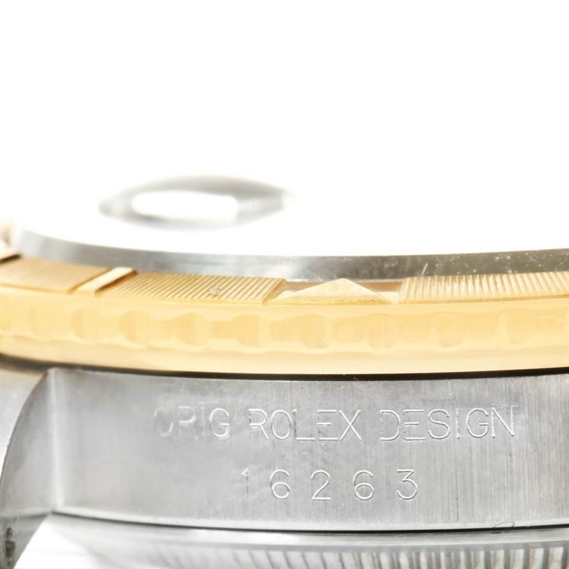 The image shows a close-up side view of the bezel and part of the case of a Rolex Turn-o-Graph 16263 Men
s Steel and Gold (two tone) White Dial 16263 Men
s Steel and Gold (two tone) White Dial model, showcasing the model number and design engraving.