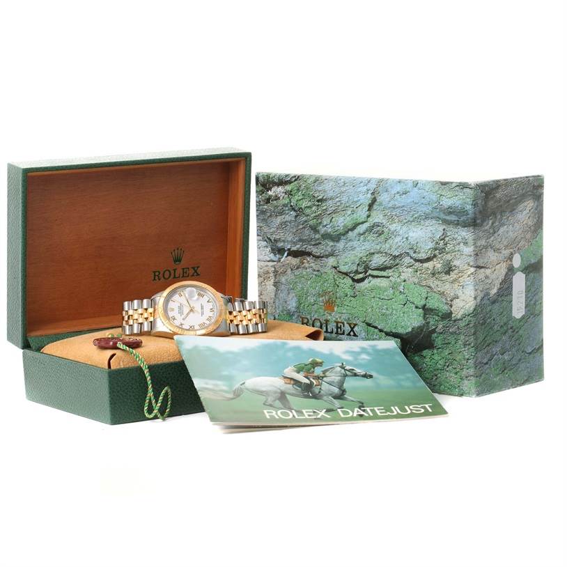 The image shows a Rolex Turn-o-Graph 16263 Men
s Steel and Gold (two tone) White Dial 16263 Men
s Steel and Gold (two tone) White Dial watch at an angle inside its box alongside a booklet and packaging.