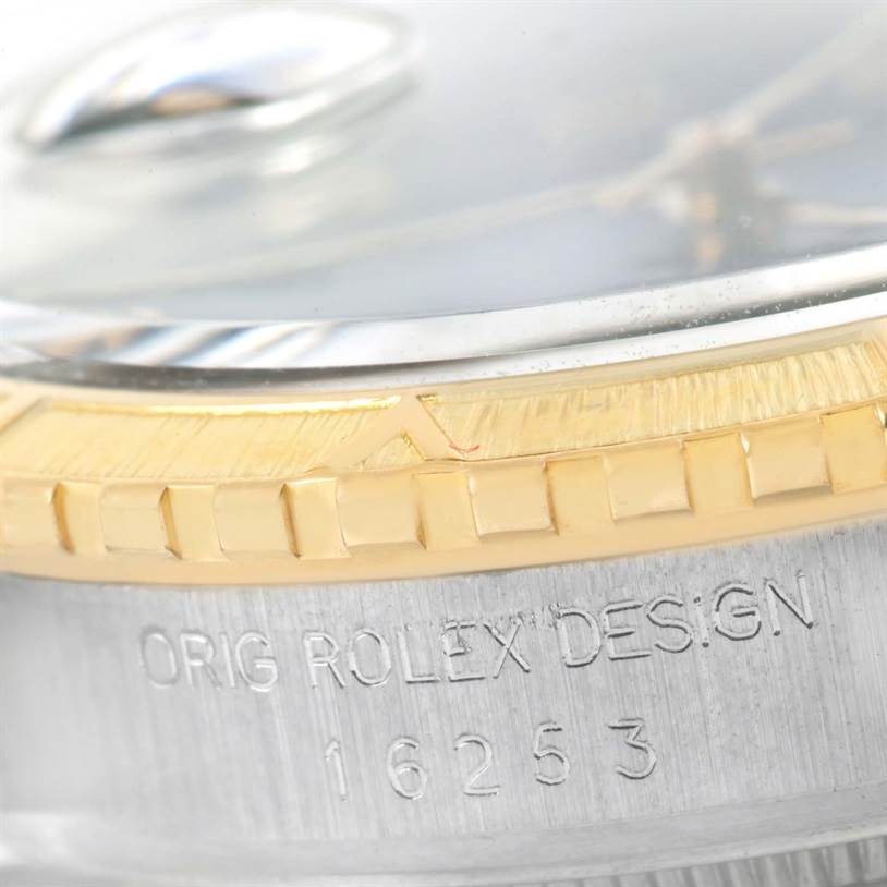 The image shows a close-up of the bezel, case side, and part of the crystal of the Rolex Turn-o-Graph 16253 Men
s Steel and Gold (two tone) Blue Dial 16253 Men
s Steel and Gold (two tone) Blue Dial model.