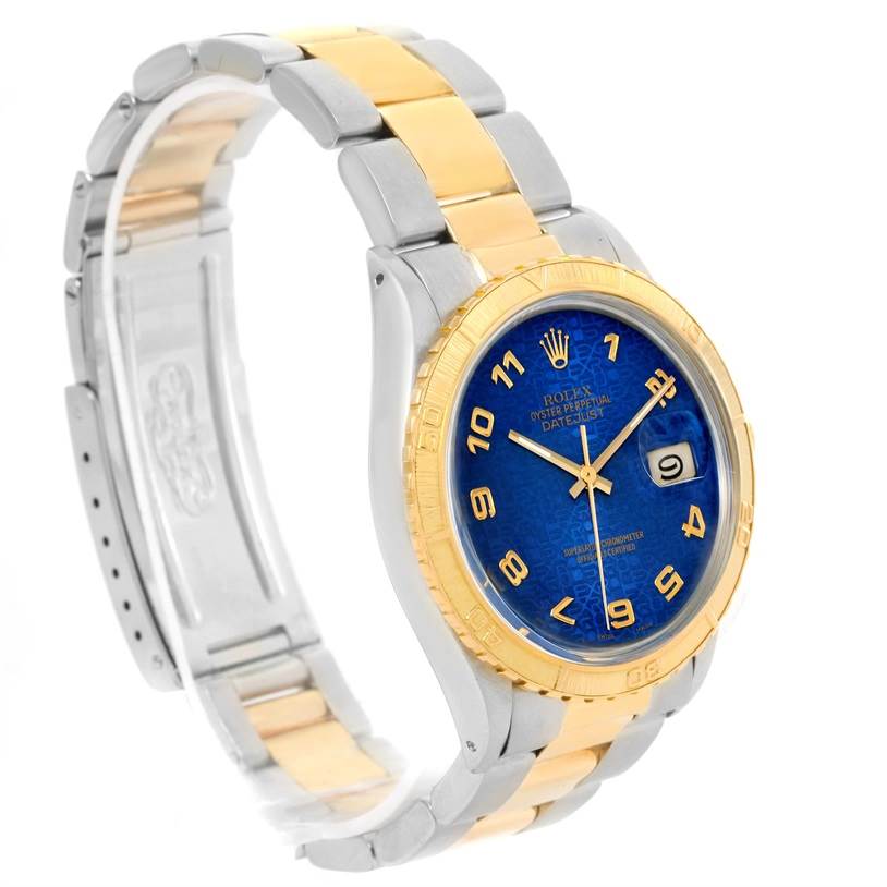 The image shows an angled view of a Rolex Turn-o-Graph 16253 Men
s Steel and Gold (two tone) Blue Dial 16253 Men
s Steel and Gold (two tone) Blue Dial watch, highlighting the gold and silver bracelet and blue dial with date feature.