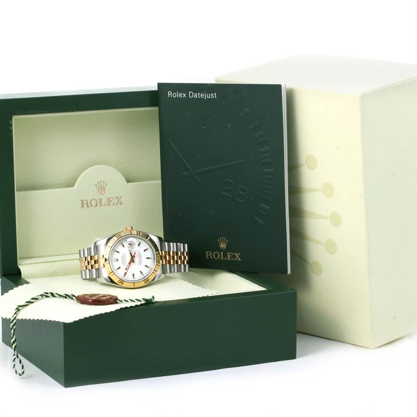 A Rolex Turn-o-Graph 116263 Men's Stainless Steel White Dial 116263 Men's Stainless Steel White Dial watch is displayed frontally in its original box with its booklet and accessories.
