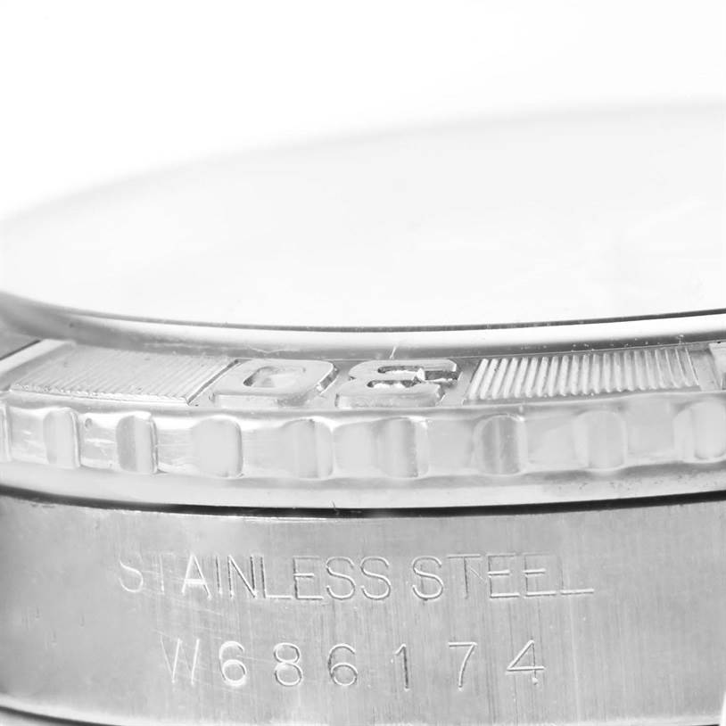 This image shows a close-up of the bezel and part of the stainless steel case of the Rolex Turn-o-Graph 16264 Men
s Stainless Steel White Dial 16264 Men
s Stainless Steel White Dial watch, with visible engravings.