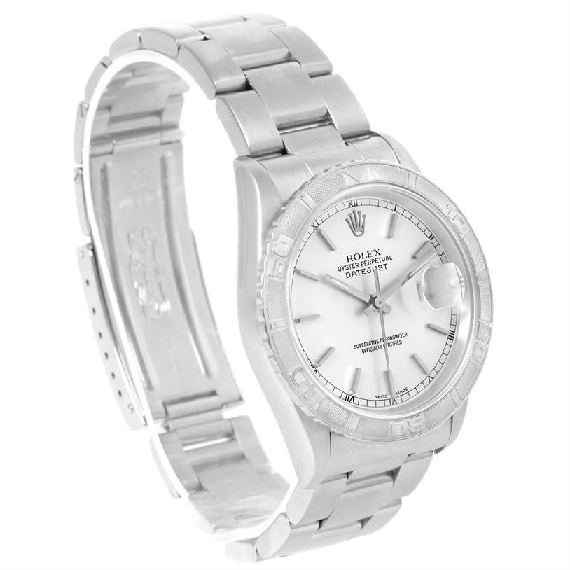 The image shows a Rolex Turn-o-Graph 16264 Men
s Stainless Steel White Dial 16264 Men
s Stainless Steel White Dial watch from an angled side view that displays the face, bezel, and metal bracelet.