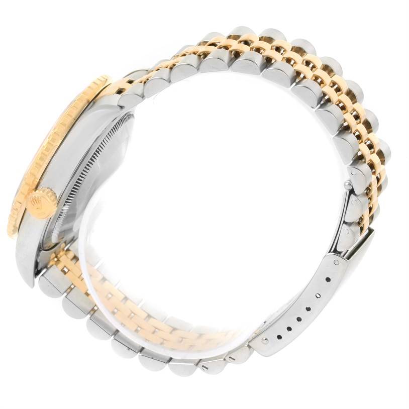 This image shows the side profile of a Rolex Turn-o-Graph 16263 Men's Steel and Gold (two tone) Grey Dial 16263 Men's Steel and Gold (two tone) Grey Dial watch, highlighting its bezel, crown, and two-tone bracelet.