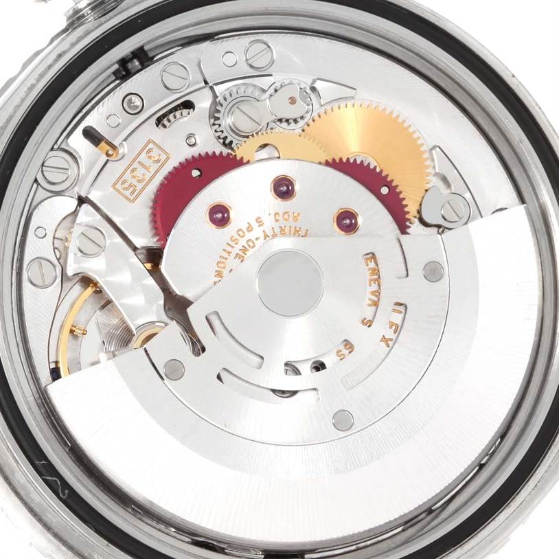 This close-up, top-down view of a Rolex Turn-o-Graph 16264 Men's Stainless Steel Black Dial 16264 Men's Stainless Steel Black Dial showcases its intricate inner mechanical components and gears.