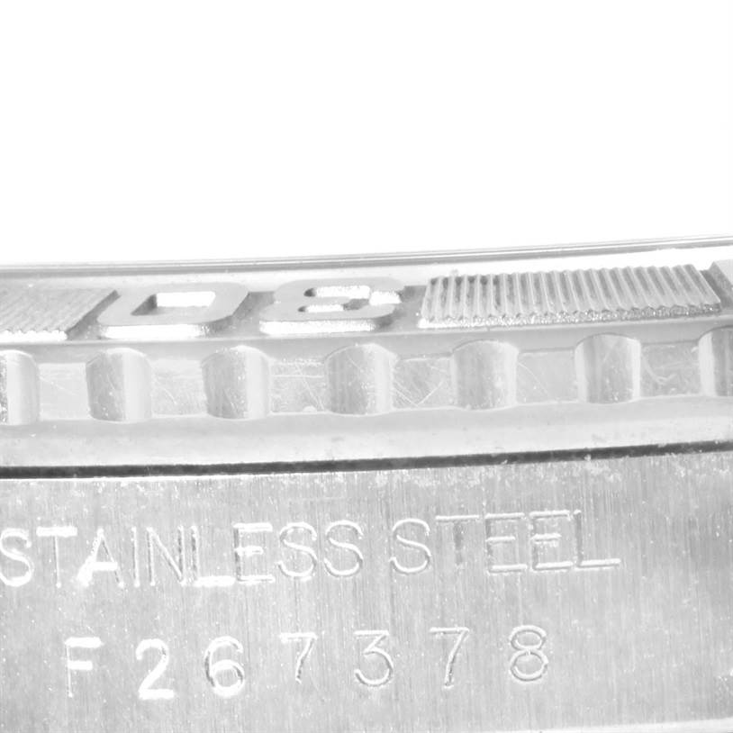 Close-up of the bezel and case back, showing the "STAINLESS STEEL" engraving and part of the serial number on a Rolex Turn-o-Graph 16264 Men's Stainless Steel Black Dial 16264 Men's Stainless Steel Black Dial.