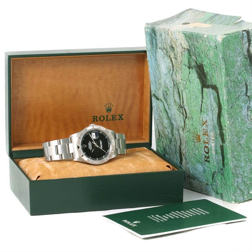 The Rolex Turn-o-Graph 16264 Men's Stainless Steel Black Dial 16264 Men's Stainless Steel Black Dial watch is shown resting inside an open green Rolex box with the outer box and documentation visible.