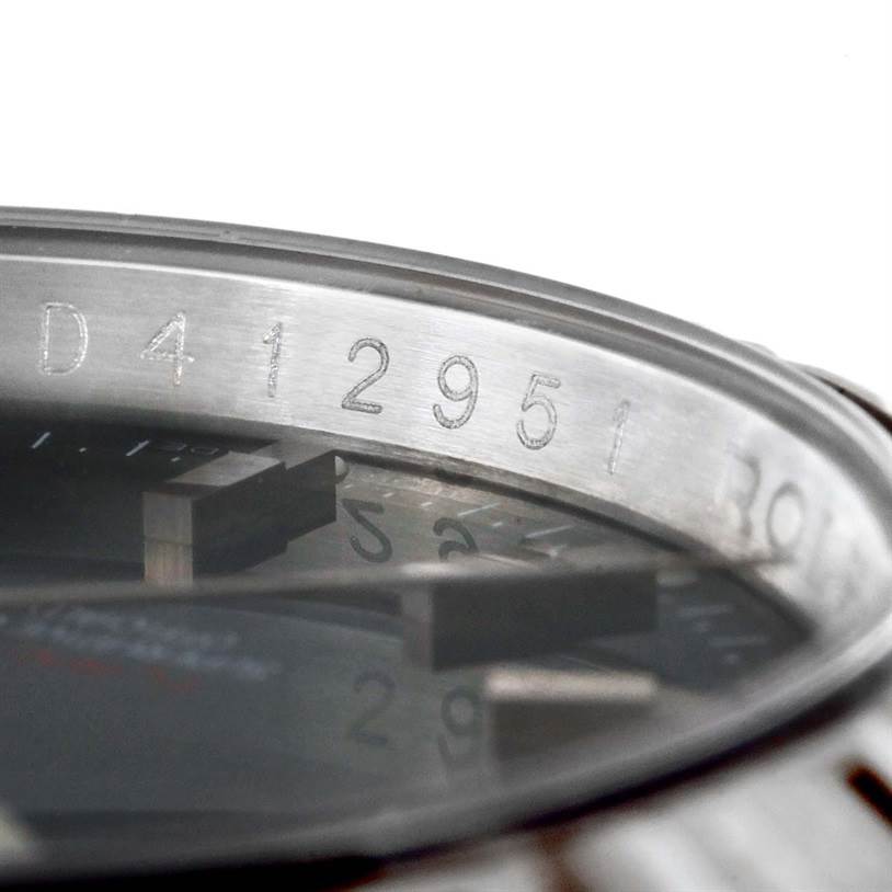 This image shows a close-up of the case serial number on a Rolex Turn-o-Graph 116264 Men's Stainless Steel Blue Dial 116264 Men's Stainless Steel Blue Dial watch.