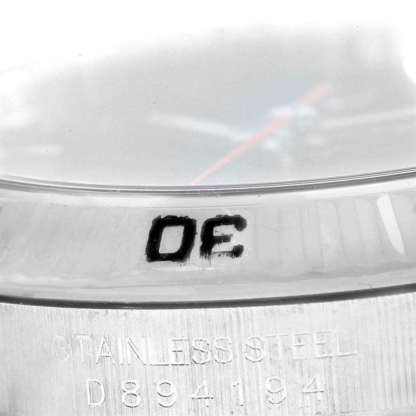 This close-up image shows the engraving on the case side and the bezel of a Rolex Turn-o-Graph 116264 Men's Stainless Steel Black Dial 116264 Men's Stainless Steel Black Dial watch.