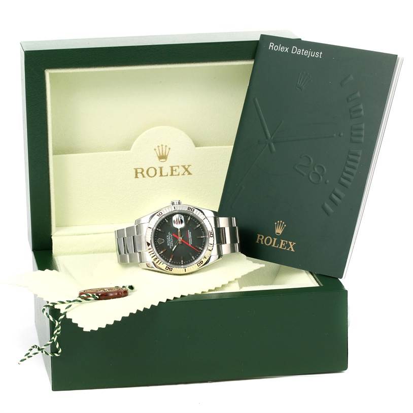 The image shows a Rolex Turn-o-Graph 116264 Men's Stainless Steel Black Dial 116264 Men's Stainless Steel Black Dial watch at an angled front view, along with its box, booklet, and tag.