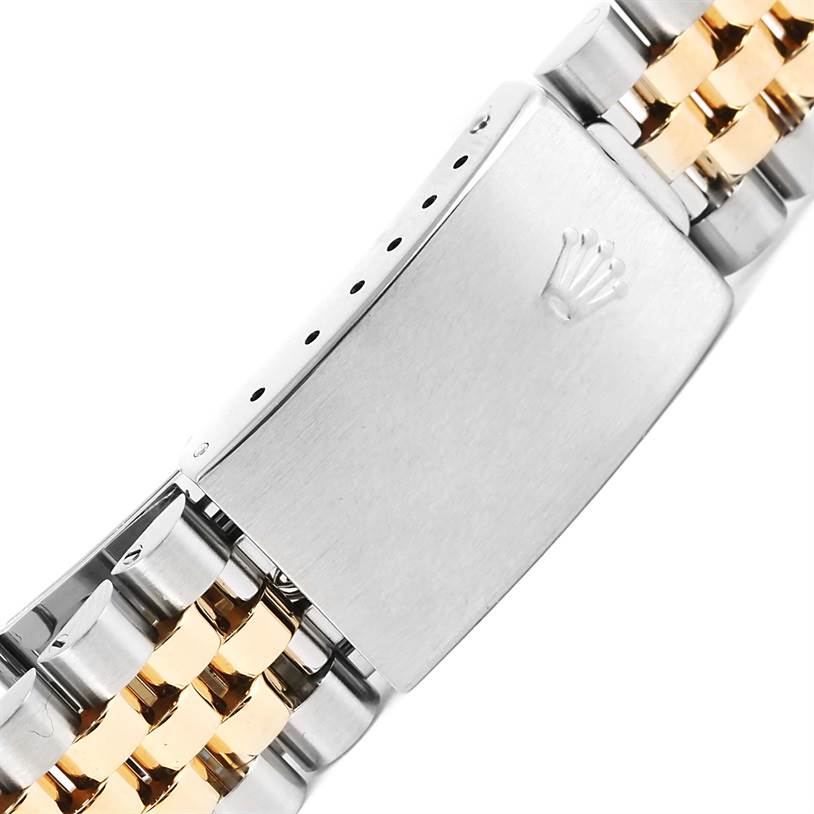 The image shows the clasp and part of the bracelet of a Turn-o-Graph model by Rolex, featuring a two-tone metal design.