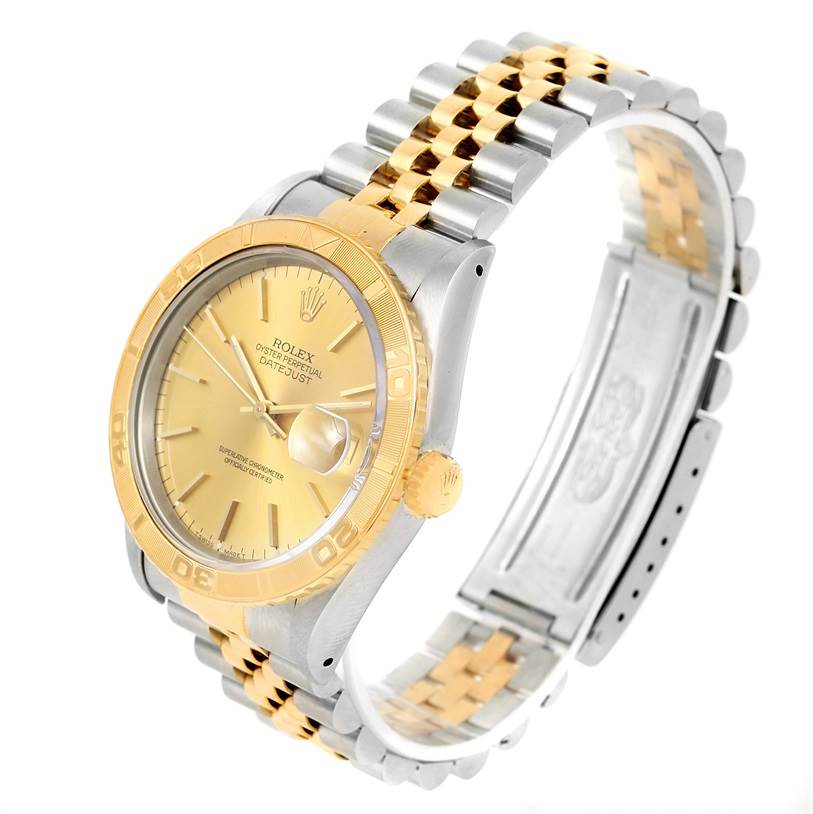 The image shows a Rolex Turn-o-Graph 16263 Men's Steel and Gold (two tone) Champagne Dial 16263 Men's Steel and Gold (two tone) Champagne Dial watch from a side angle, highlighting its gold bezel, dial, and two-tone bracelet.