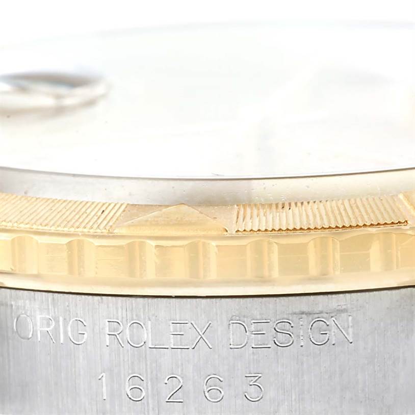 Close-up of a Rolex Turn-o-Graph 16263 Men's Steel and Gold (two tone) Champagne Dial 16263 Men's Steel and Gold (two tone) Champagne Dial watch showing the bezel, crystal, and part of the case with model number 16263 engraved.