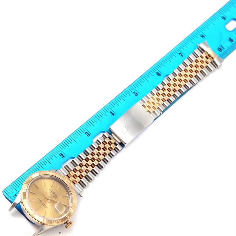 The image shows a Rolex Turn-o-Graph 16263 Men's Steel and Gold (two tone) Champagne Dial 16263 Men's Steel and Gold (two tone) Champagne Dial watch next to a ruler, focusing on the face and metal bracelet.