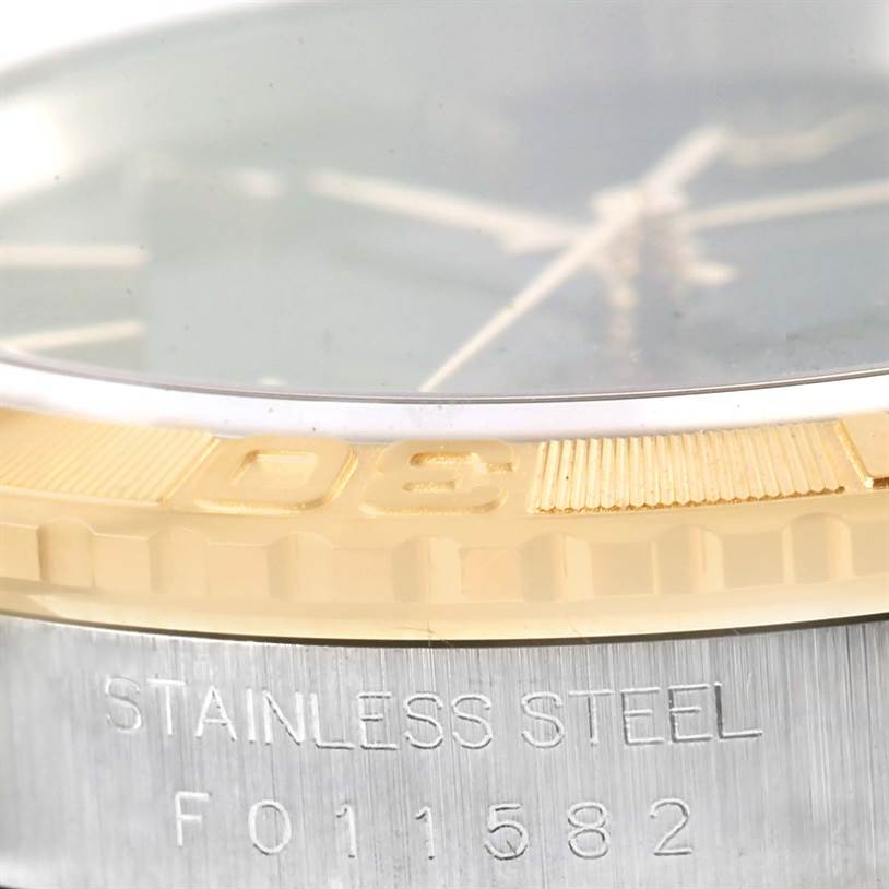 The image shows a close-up of the bezel and stainless steel casing with the serial number of a Rolex Turn-o-Graph 16263 Men
s Steel and Gold (two tone) Black Dial 16263 Men
s Steel and Gold (two tone) Black Dial watch.
