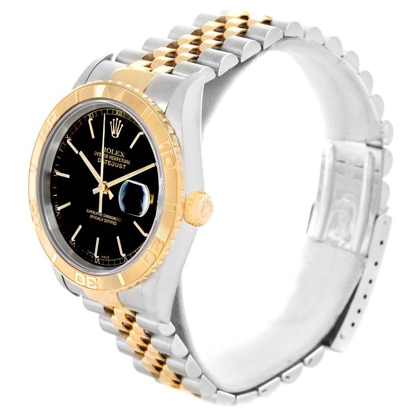 The image shows the Rolex Turn-o-Graph 16263 Men
s Steel and Gold (two tone) Black Dial 16263 Men
s Steel and Gold (two tone) Black Dial watch from an angled side view with a focus on its two-tone bracelet and black dial.