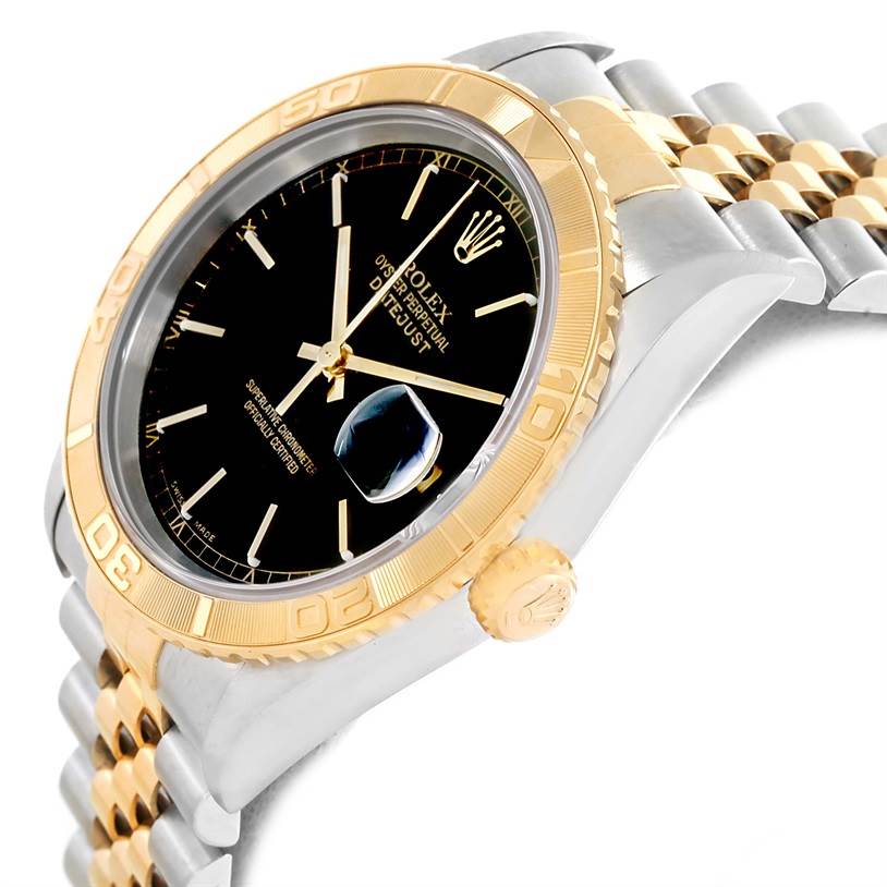 The image shows a side view of a Rolex Turn-o-Graph 16263 Men
s Steel and Gold (two tone) Black Dial 16263 Men
s Steel and Gold (two tone) Black Dial, highlighting the bezel, crown, face, and part of the bracelet.