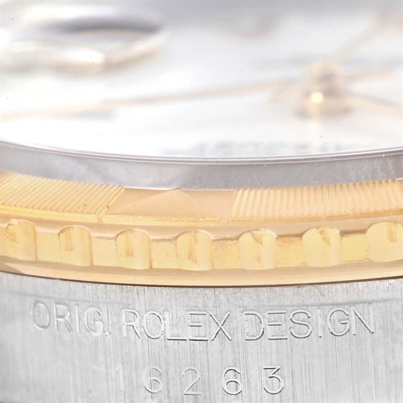 The image shows a close-up angle of the bezel, crystal, and case edge of a Rolex Turn-o-Graph 16263 Men's Steel and Gold (two tone) White Dial 16263 Men's Steel and Gold (two tone) White Dial watch, focusing on the bezel and engraved design details.