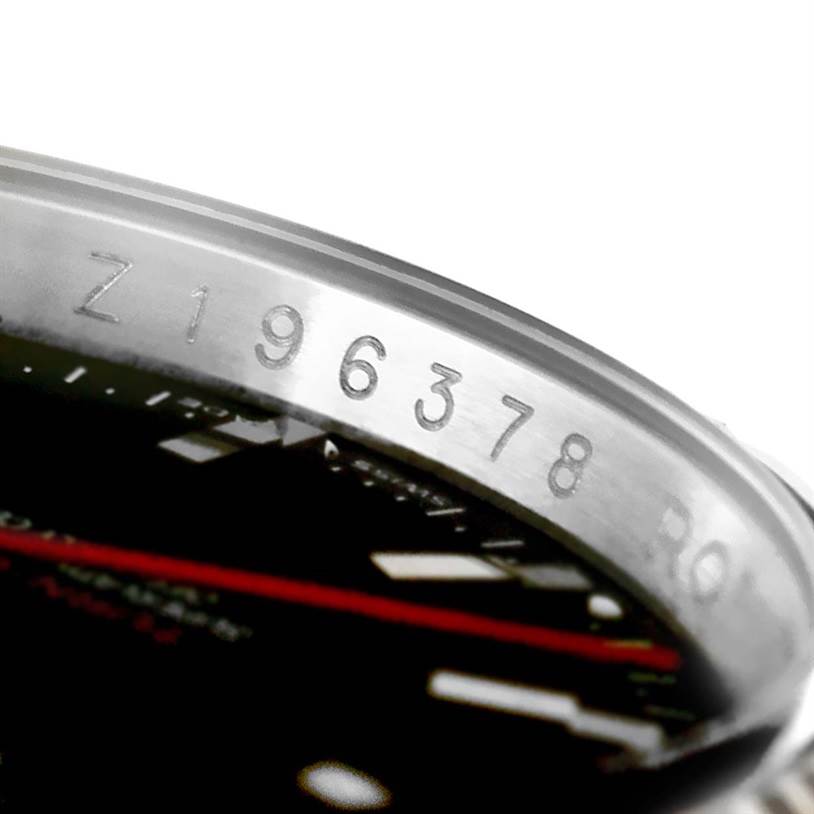 The image shows a close-up of the Turn-o-Graph model by Rolex, focusing on the serial number and a portion of the bezel and dial.