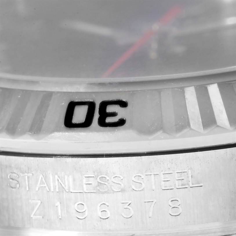The image shows a close-up of the bezel and case back of a Rolex Turn-o-Graph 116264 Men
s Stainless Steel Black Dial 116264 Men
s Stainless Steel Black Dial watch, highlighting the "30" marker and serial number.