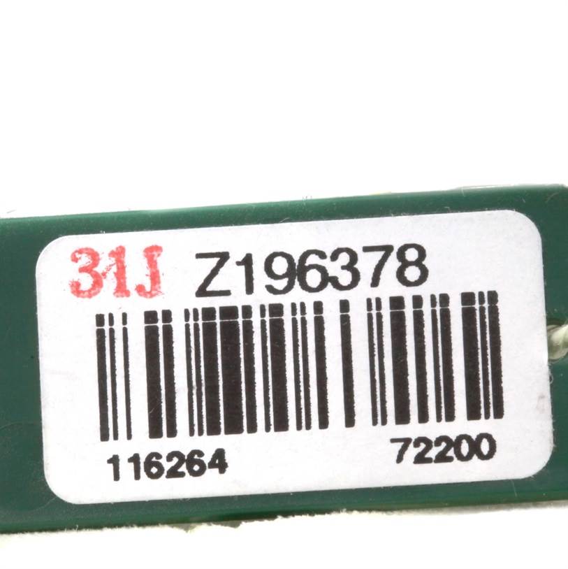 This image shows a close-up of a tag with a serial number for the Rolex Turn-o-Graph 116264 Men
s Stainless Steel Black Dial 116264 Men
s Stainless Steel Black Dial model.