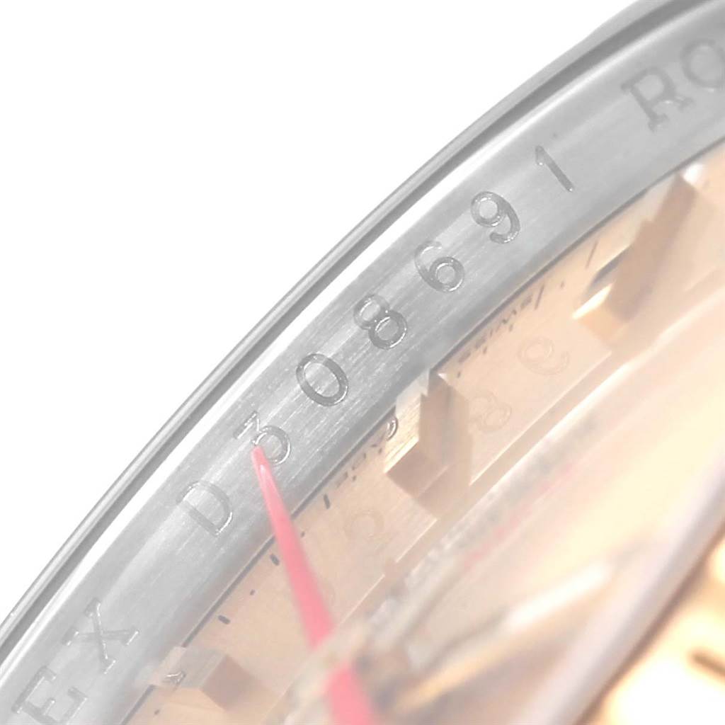 This image shows a close-up of the outer rim and the edge of the dial on a Rolex Turn-o-Graph 116263 Men
s Stainless Steel Champagne Dial 116263 Men
s Stainless Steel Champagne Dial watch, revealing part of its serial number.