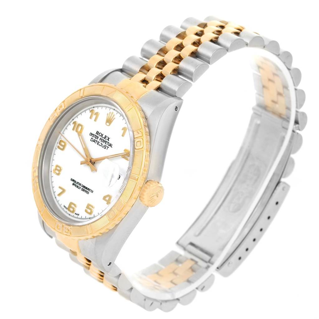 The Rolex Turn-o-Graph 16263 Men
s Steel and Gold (two tone) White Dial 16263 Men
s Steel and Gold (two tone) White Dial watch is shown at a three-quarter angle, highlighting the face, bezel, crown, and bracelet.