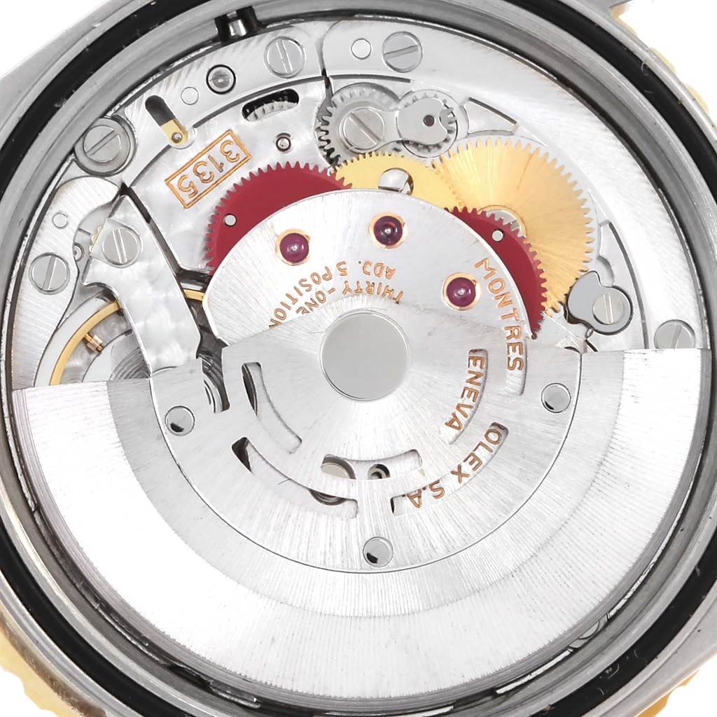 This image shows the intricate internal mechanics and gears of the Rolex Turn-o-Graph 16263 Men
s Steel and Gold (two tone) White Dial 16263 Men
s Steel and Gold (two tone) White Dial watch from a close-up, back view angle.