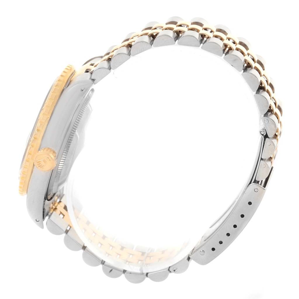 The Rolex Turn-o-Graph 16263 Men
s Steel and Gold (two tone) White Dial 16263 Men
s Steel and Gold (two tone) White Dial watch is shown from the side, highlighting the band, crown, and part of the bezel.