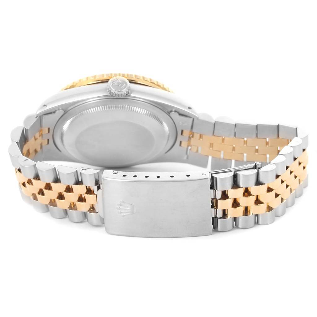 This image shows the back and band of a Rolex Turn-o-Graph 16263 Men
s Steel and Gold (two tone) White Dial 16263 Men
s Steel and Gold (two tone) White Dial watch at an angle highlighting the clasp and case back.