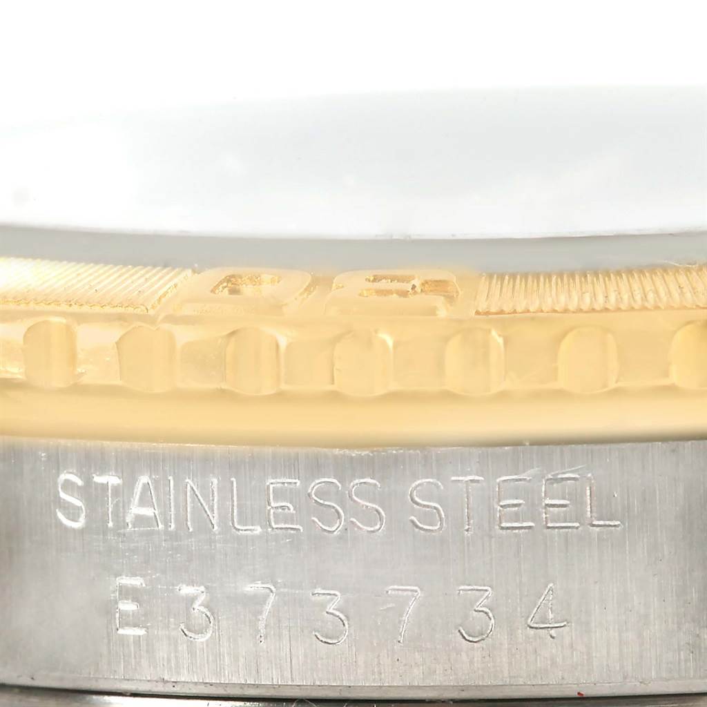 The image shows a close-up of the stainless steel serial number section and the gold bezel of the Rolex Turn-o-Graph 16263 Men
s Steel and Gold (two tone) White Dial 16263 Men
s Steel and Gold (two tone) White Dial watch.