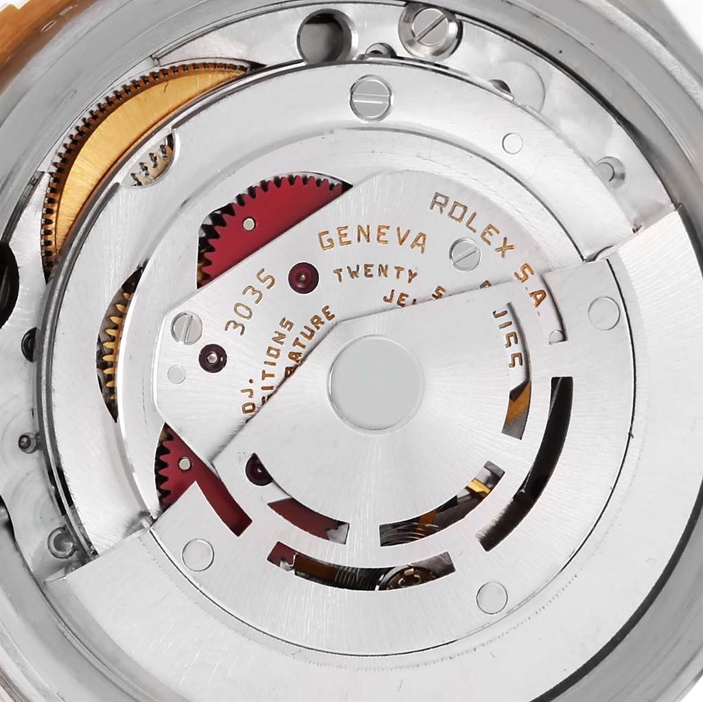 The image shows the internal mechanism of a Rolex Turn-o-Graph 16253 Men's Steel and Gold (two tone) Black Dial 16253 Men's Steel and Gold (two tone) Black Dial watch, including gears and the rotor, viewed from the back.