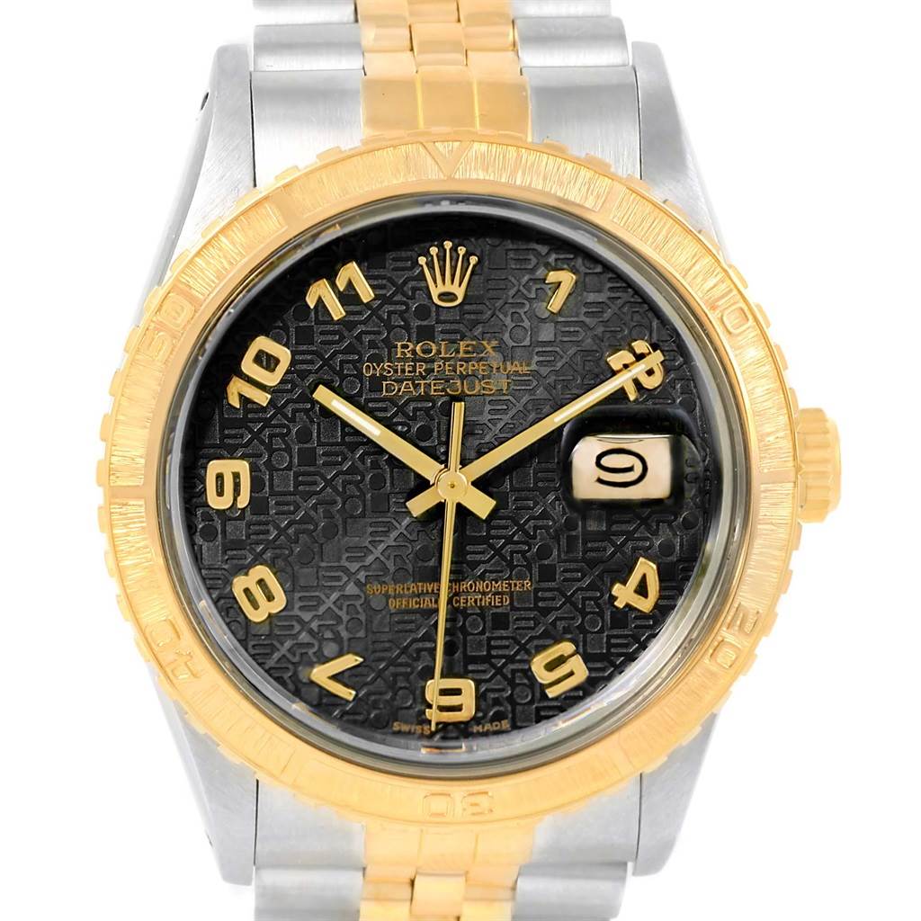This Rolex Turn-o-Graph 16253 Men's Steel and Gold (two tone) Black Dial 16253 Men's Steel and Gold (two tone) Black Dial model watch is shown from the front, displaying its dial, date window, and gold bezel.